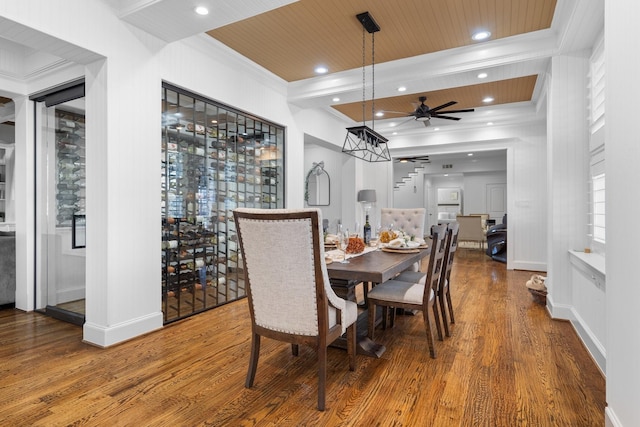 dining space featuring ceiling fan, wood ceiling, and hardwood / wood-style floors