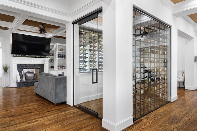110 Quiet Hill Cir, Copper Canyon, TX 76226 - wine cellar featuring a ceiling fan, wood finished floors, a fireplace, beamed ceiling, and coffered ceiling