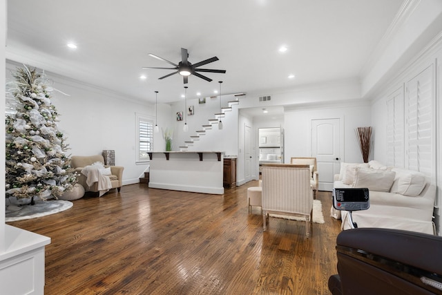 living room featuring ceiling fan, dark hardwood / wood-style flooring, and ornamental molding