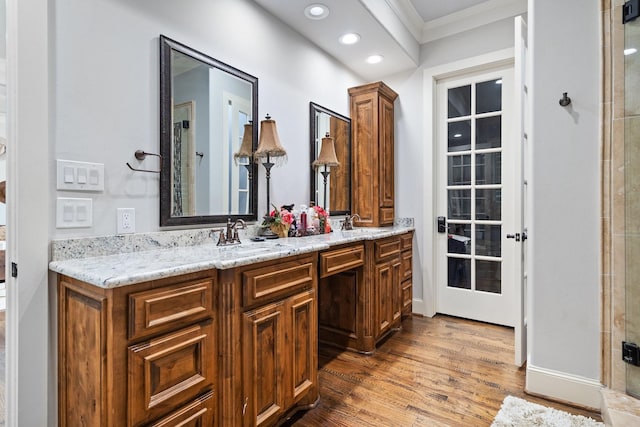 110 Quiet Hill Cir, Copper Canyon, TX 76226 - bathroom featuring wood finished floors, crown molding, double vanity, recessed lighting, and an enclosed shower