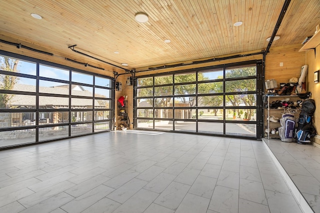 interior space with wood ceiling and wood walls