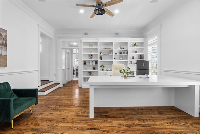 office area featuring ceiling fan, dark wood-type flooring, and crown molding