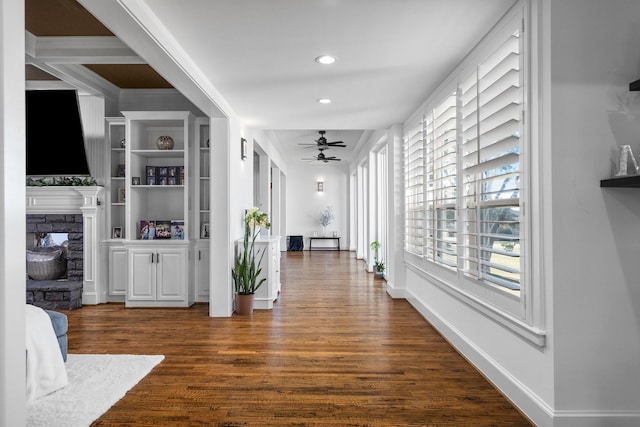 corridor featuring dark hardwood / wood-style floors and built in shelves