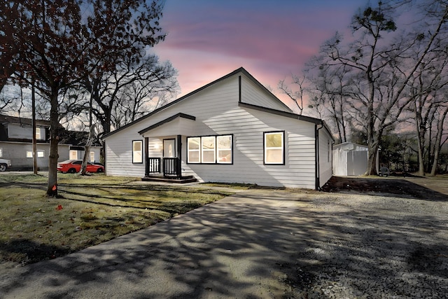 ranch-style home with a lawn