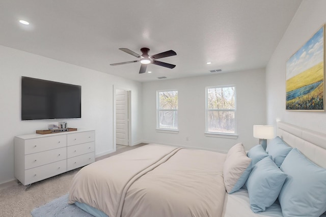 carpeted bedroom with ceiling fan