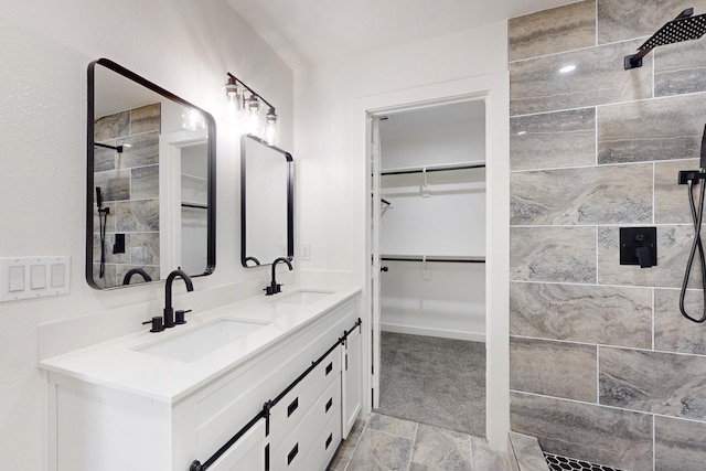 bathroom with walk in shower and vanity