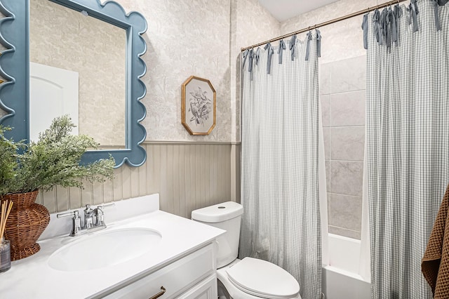 full bathroom featuring toilet, vanity, and shower / tub combo with curtain