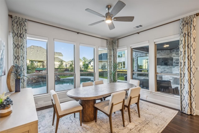 sunroom / solarium with ceiling fan