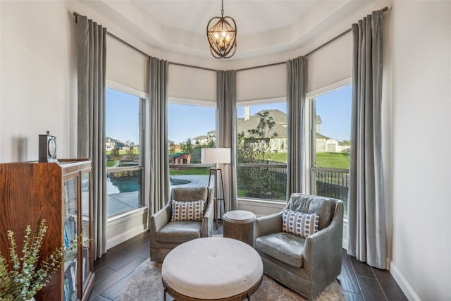 living area featuring an inviting chandelier