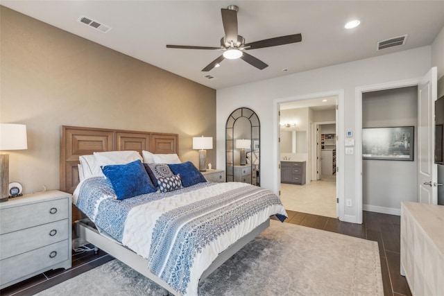 bedroom with ceiling fan and connected bathroom