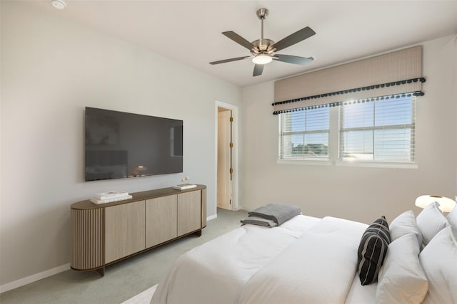 bedroom featuring ceiling fan and light colored carpet