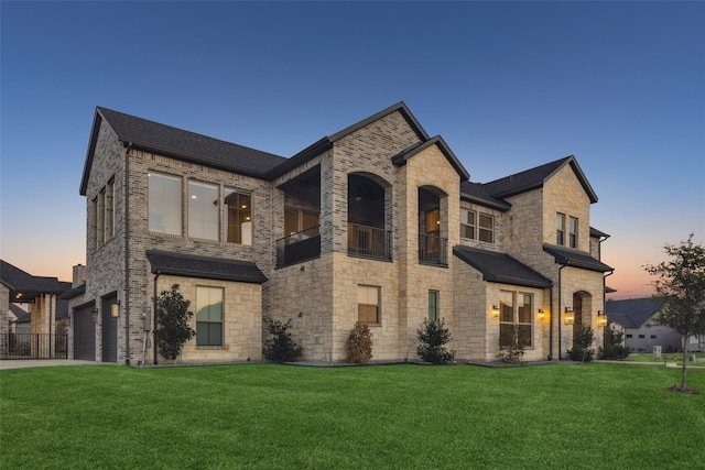 view of front facade with a lawn and a garage