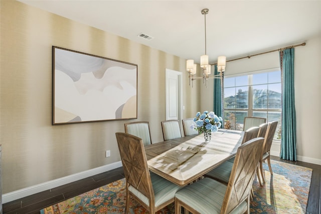 dining area with an inviting chandelier