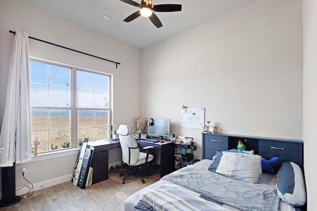 bedroom featuring ceiling fan and light hardwood / wood-style floors