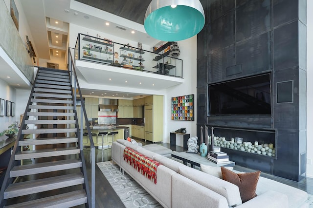 living room featuring a high ceiling