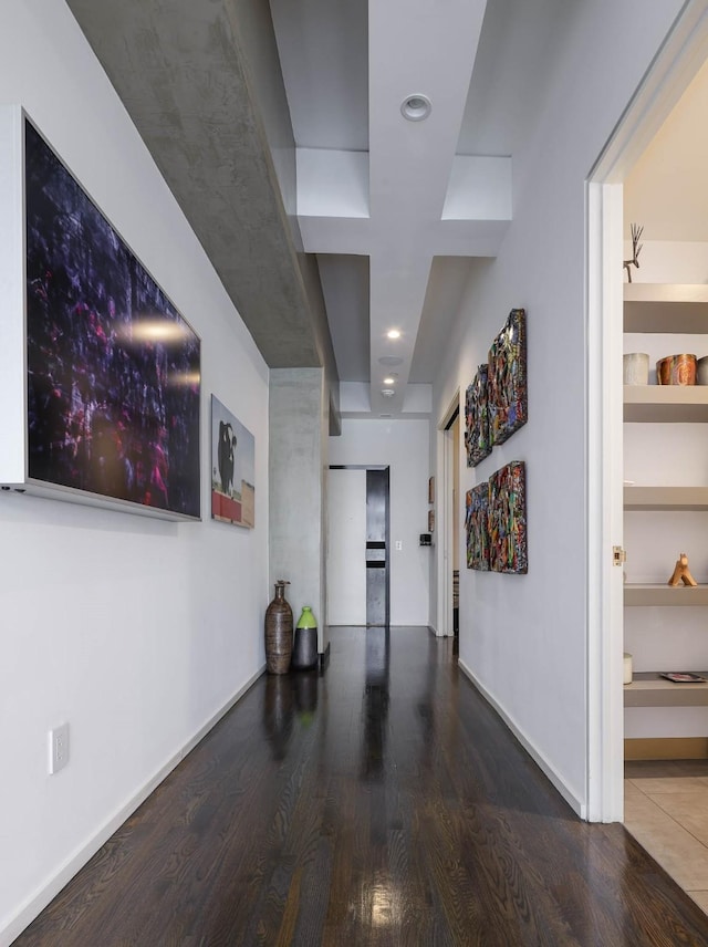 hallway with hardwood / wood-style flooring