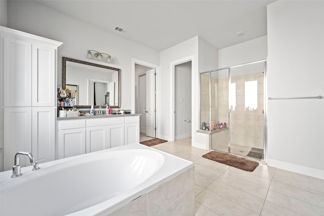 bathroom with tile patterned floors, vanity, and independent shower and bath