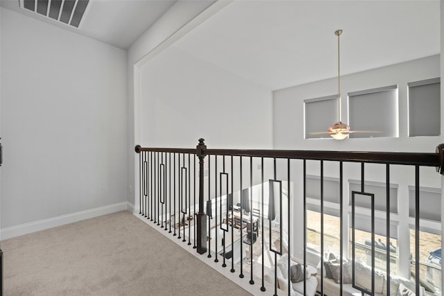 hallway featuring carpet flooring