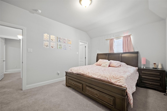 carpeted bedroom with vaulted ceiling