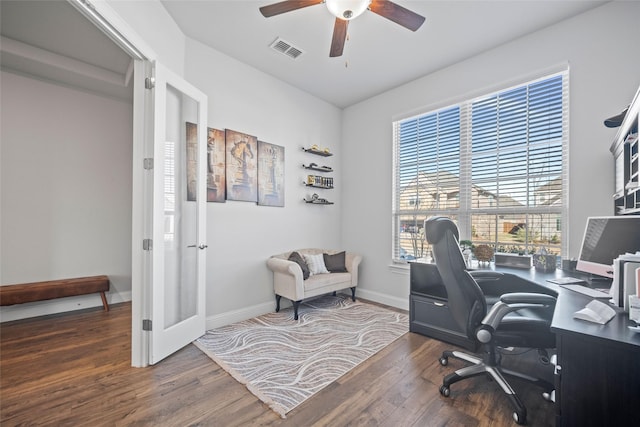 office with dark wood-type flooring and ceiling fan