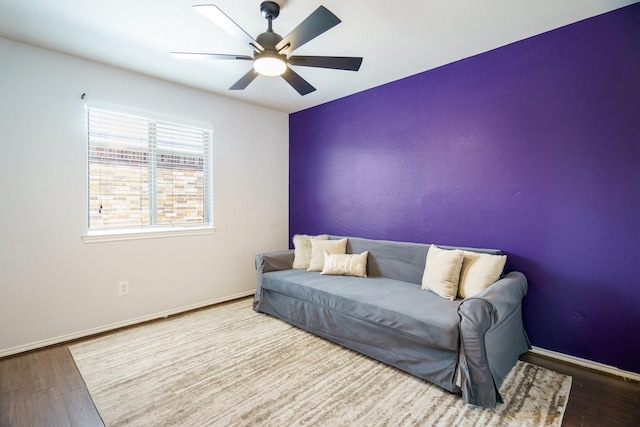 sitting room featuring hardwood / wood-style flooring and ceiling fan