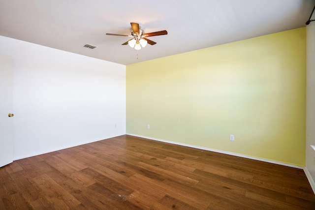 unfurnished room with dark hardwood / wood-style flooring