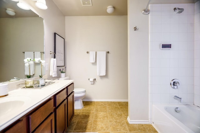 full bathroom featuring toilet, tiled shower / bath combo, and vanity