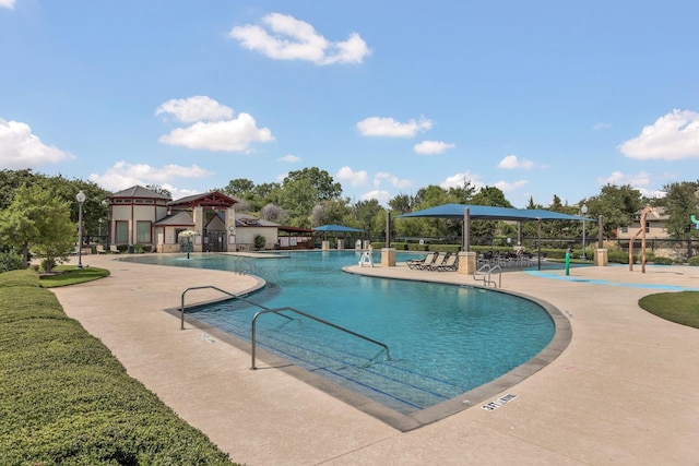 view of swimming pool with a patio area and a gazebo