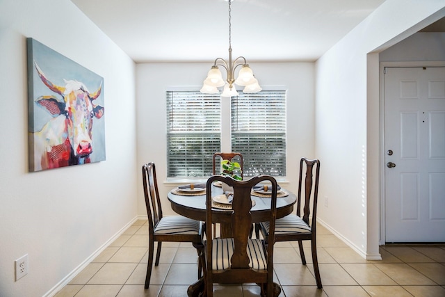 dining area featuring light tile patterned floors and a chandelier