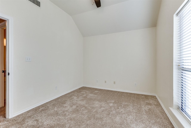 additional living space with lofted ceiling and light carpet