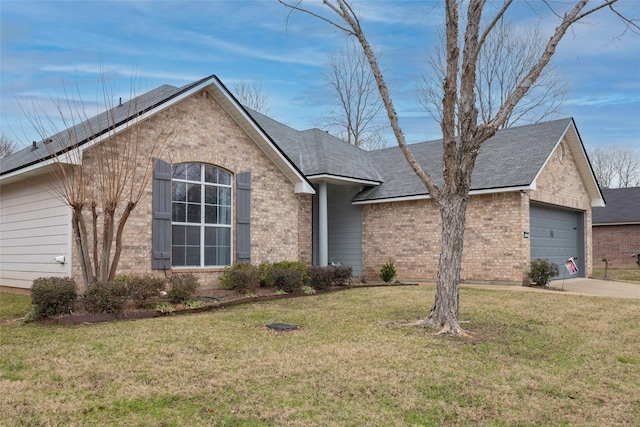 view of front of house with a garage and a front lawn