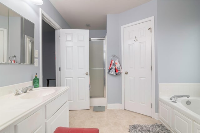 bathroom with vanity, independent shower and bath, and tile patterned flooring