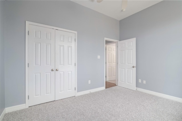 unfurnished bedroom featuring carpet floors and a closet