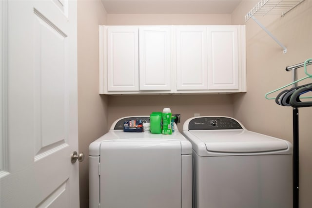 laundry area featuring cabinets and washer and dryer