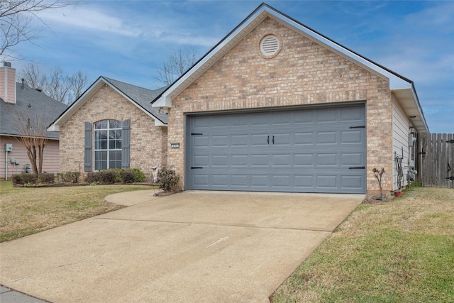 front facade featuring a garage and a front lawn