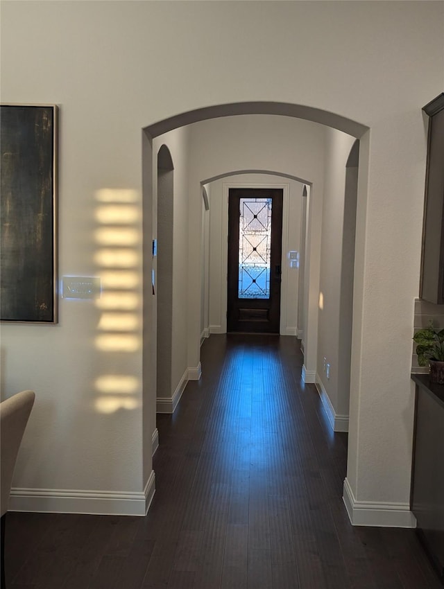 foyer with dark hardwood / wood-style floors