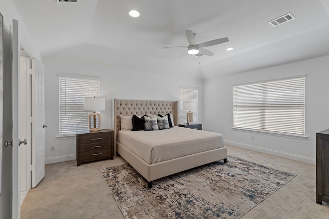 carpeted bedroom featuring ceiling fan and vaulted ceiling