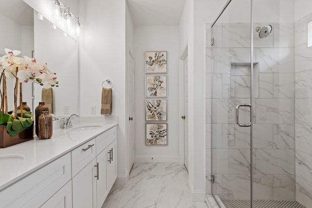 bathroom with a shower with shower door and vanity