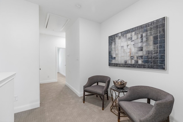 living area featuring light colored carpet