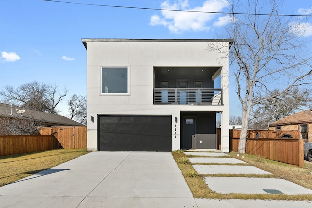 modern home featuring a balcony and a garage