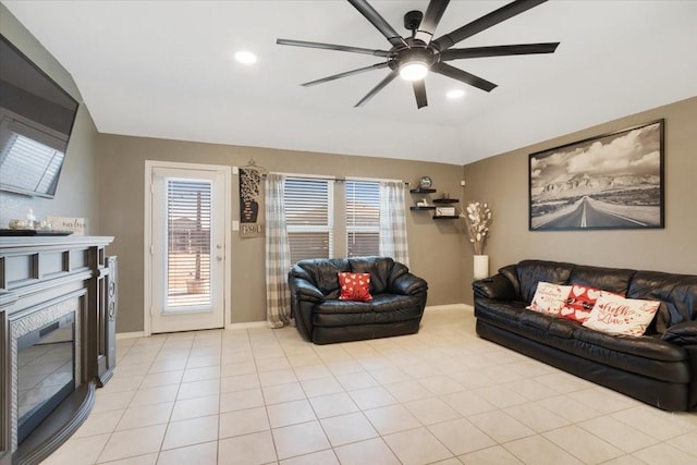 tiled living room with ceiling fan