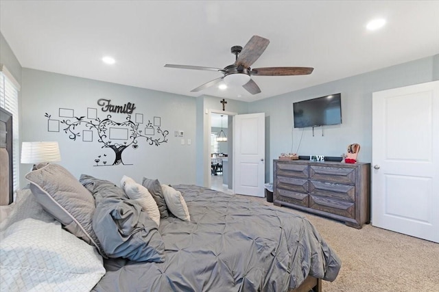 carpeted bedroom featuring ceiling fan