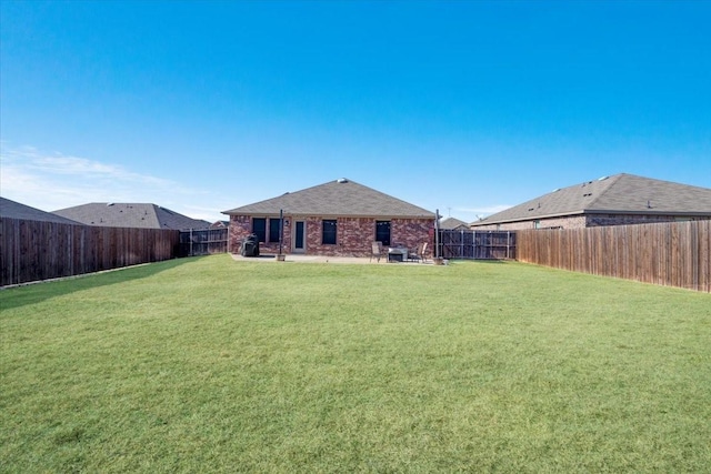 back of property featuring a patio area and a lawn