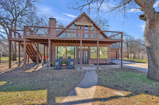 exterior space with a patio and a deck