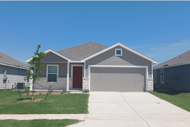 craftsman-style house featuring central AC, a garage, and a front lawn