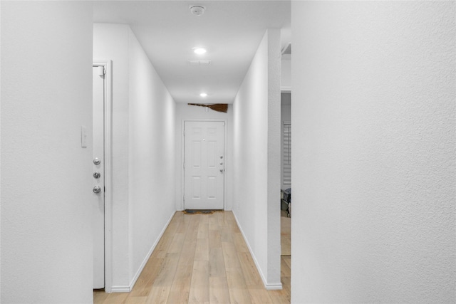 hall with light hardwood / wood-style floors