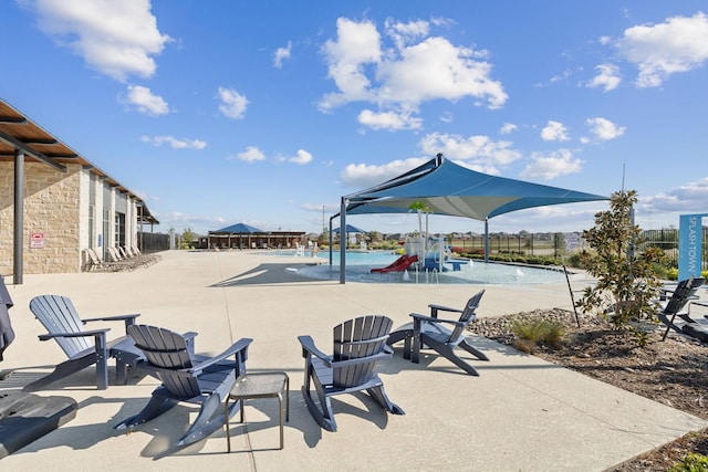 view of patio featuring a community pool