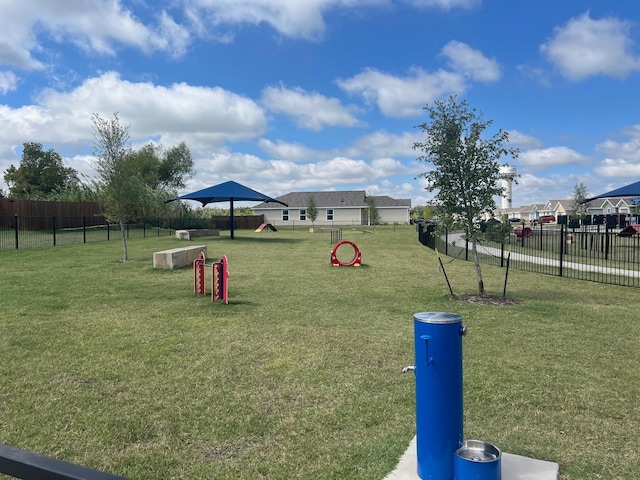 view of home's community with a yard