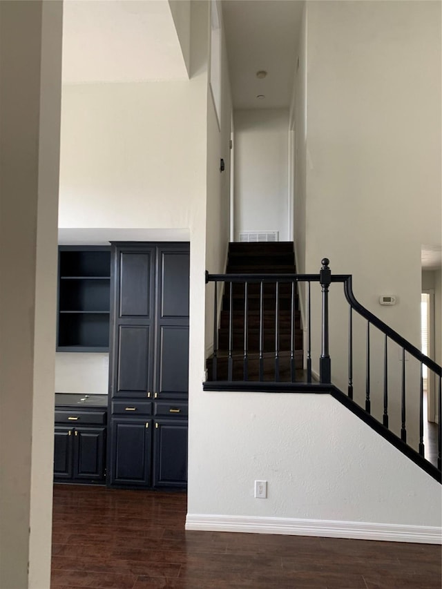 stairs featuring wood-type flooring