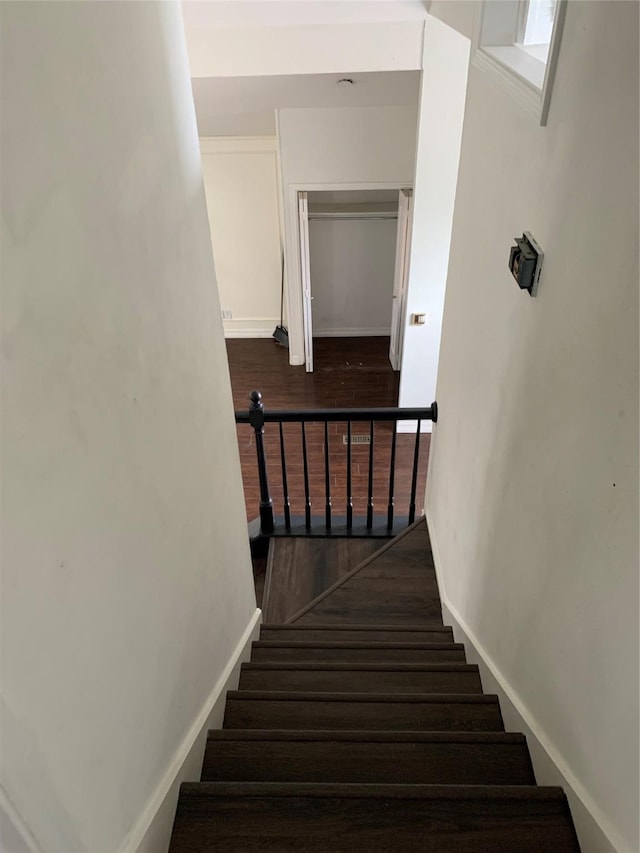 staircase featuring hardwood / wood-style floors